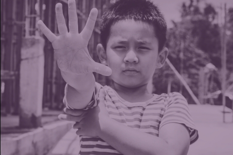 Boy holding out hand in a stop motion